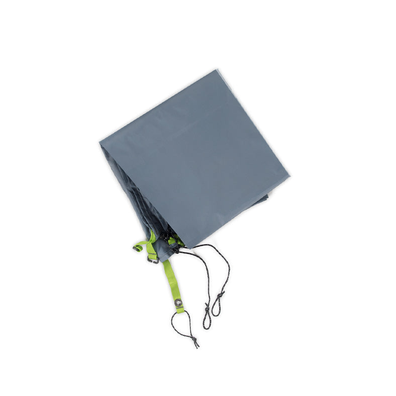 A folded NEMO Equipment Hornet OSMO™ Footprint, crafted from abrasion-resistant tarp with green straps and black cords attached, is shown on a white background.
