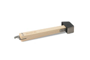 The NEMO Equipment Meldr™ Hammer features a wooden handle, black metal head, and a hooked end tool—making it an essential camping companion for outdoor adventures.