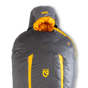 A gray and yellow NEMO Equipment Sonic™ Down Mummy Sleeping Bag with hood, logo, and Thermo Gill vents is shown upright against a plain white background.